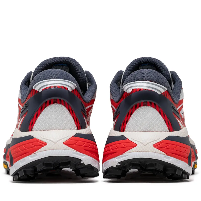 running in a marsh area shoes Hoka U Mafate Speed 2 - Cerise/White